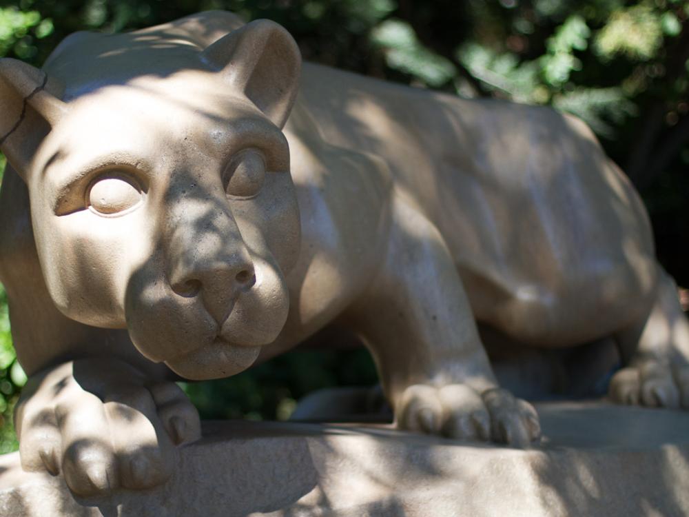 A photo of the Penn State Nittany Lion Shrine with sun peaking through shadows