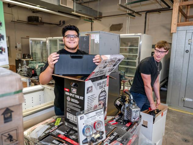 Two students working in a shop