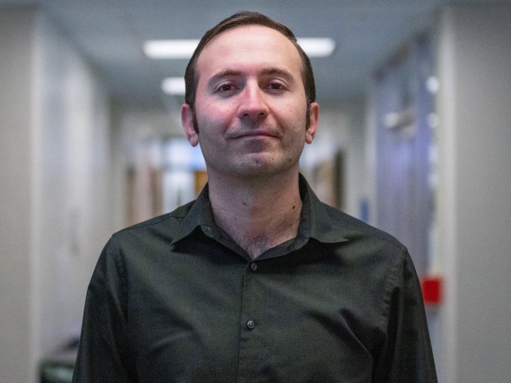 Chris Argyropoulos, an associate professor of engineering, poses for a headshot.