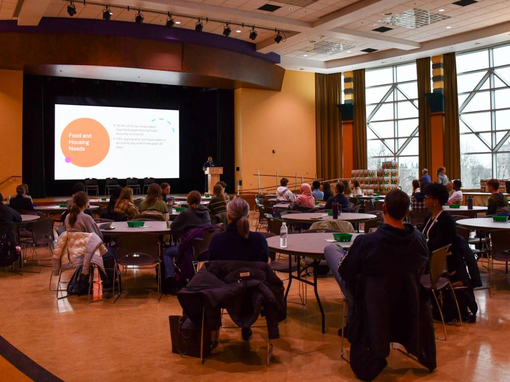 Students and faculty sit and listen to a presentation during the Food Justice Summit in the HUB-Robeson Center