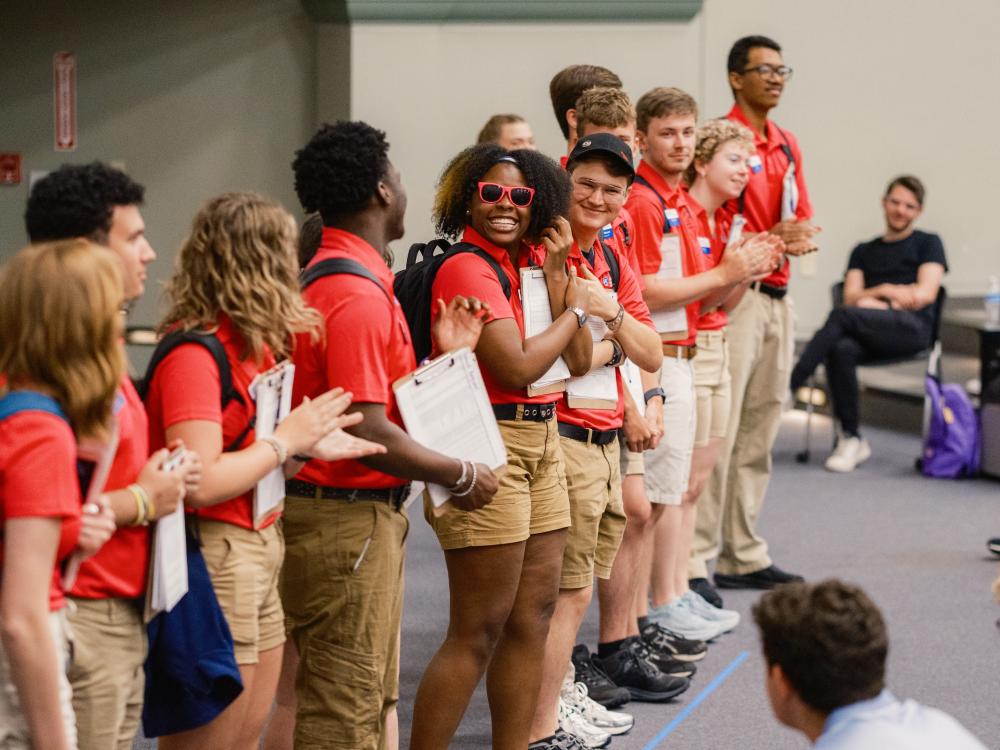 Orientation leader standing in a line