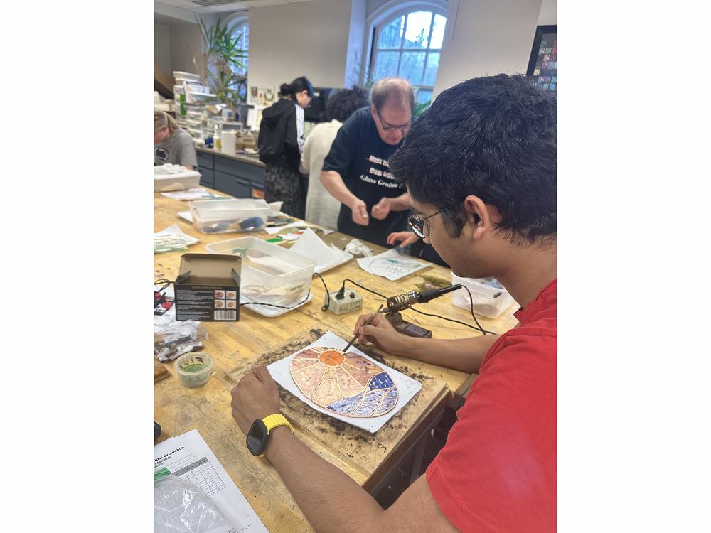 Student working in an Arts and Crafts class