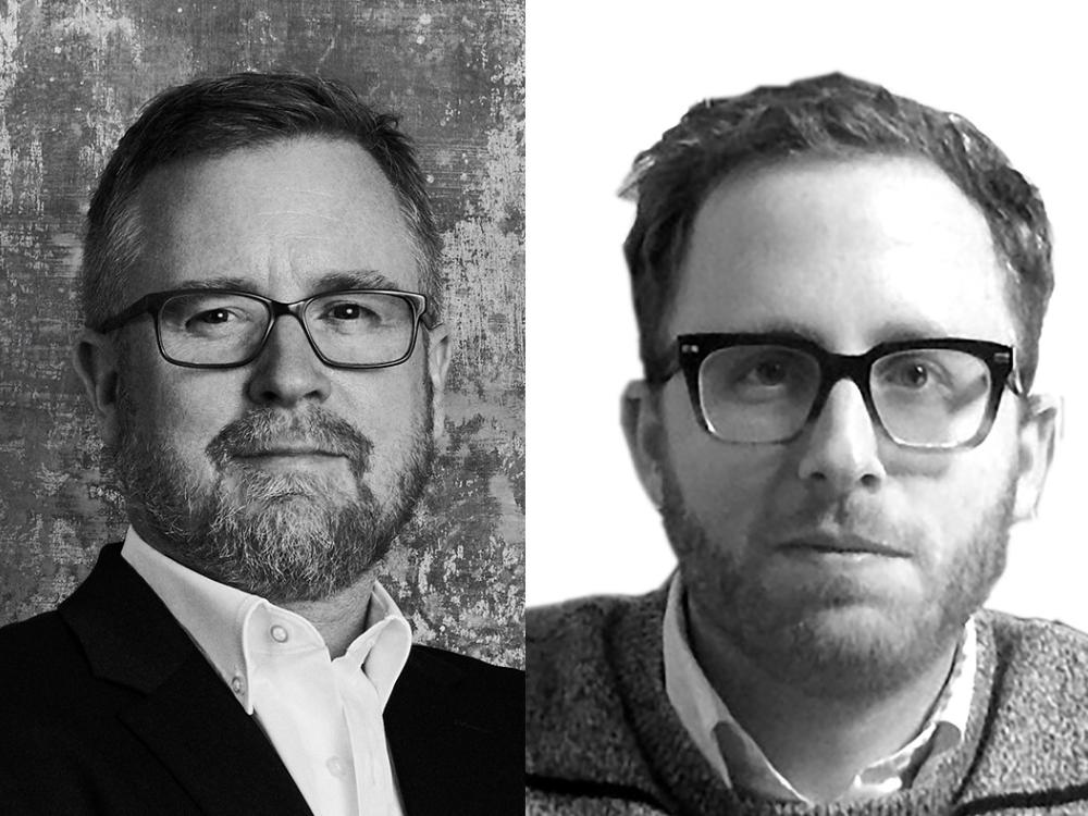 Black and white side-by-side head shots of two men each wearing glasses