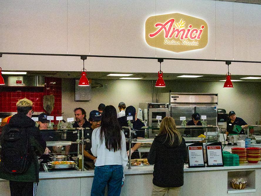 Diners visit the counter at Amici Italian Market