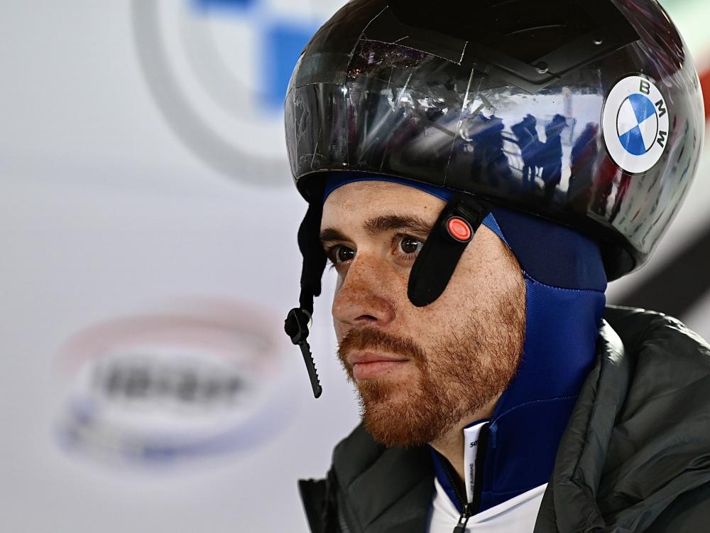 a man with a reddish beard wearing a helmet