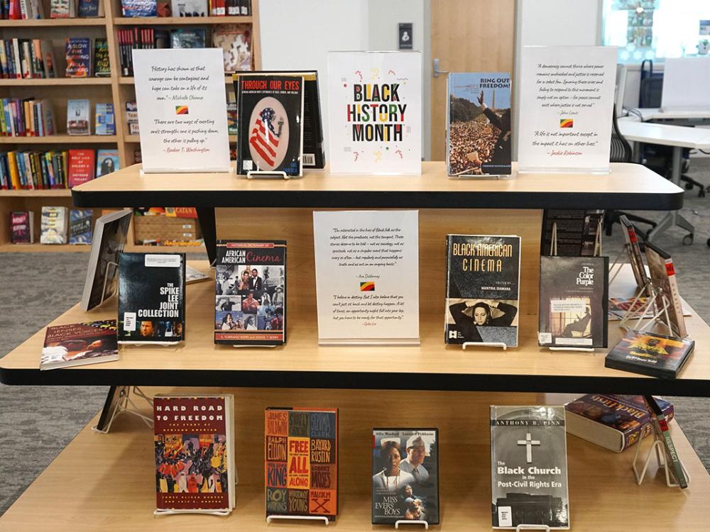 multi-tiered display of books and dvds on Black culture for Black History month display in library