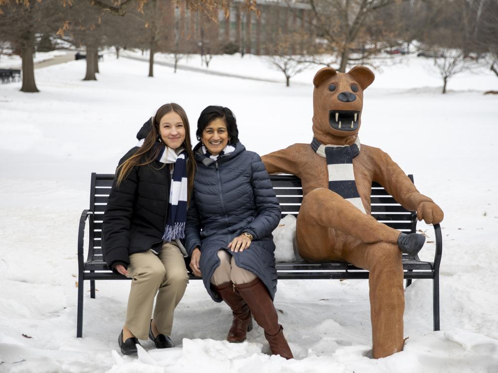 Chancellor Radha Pyati poses with her Girl Scout mentee at the Lion Bench.