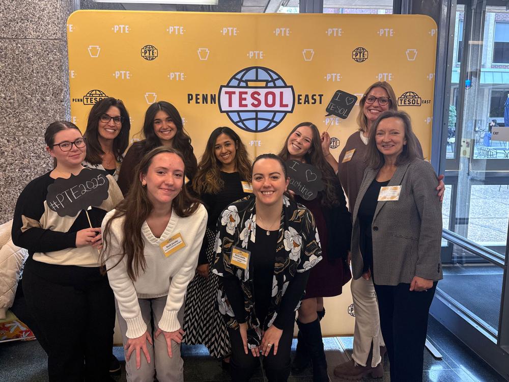 People standing in front of a banner