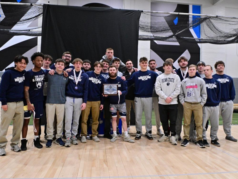 The Penn State Behrend wrestling team poses for a group photo at the Allegheny Mountain Collegiate Conference championships.