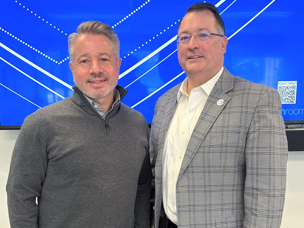 The ASHRAE President (left) stands with College of Engineering Associate Dean for Research (right)