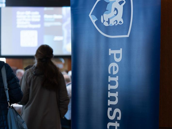 A Penn State banner outside of an open door