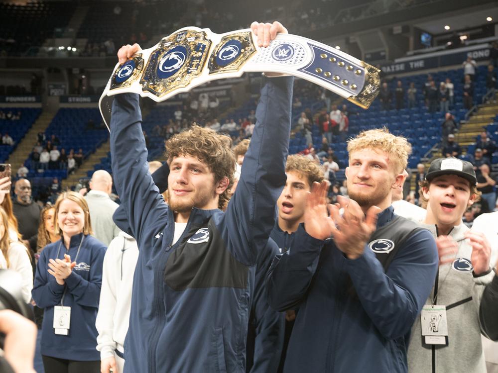 Wrestler hoists belt