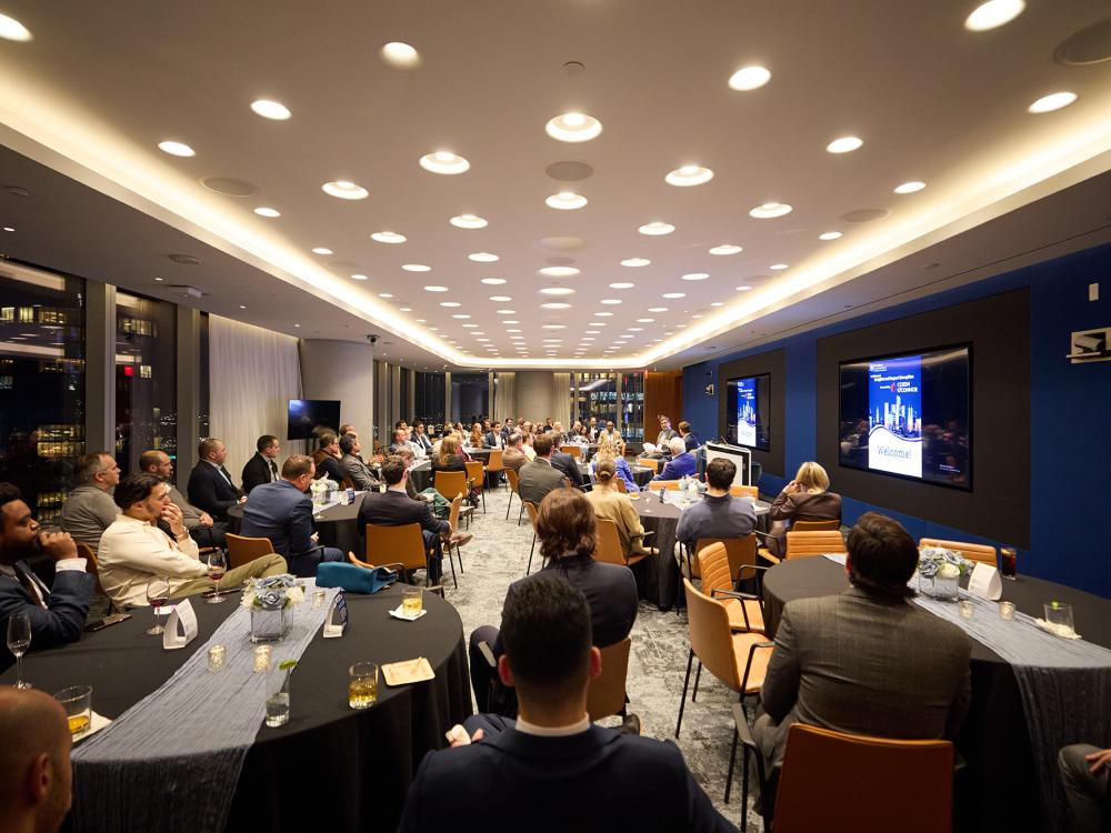 People sitting at tables in a room
