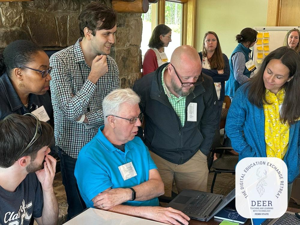 A Teaching and Learning with Technology staff member collaborating with participants of the Digital Education Exchange Retreat (DEER) on their technology-enhanced instructional material.
