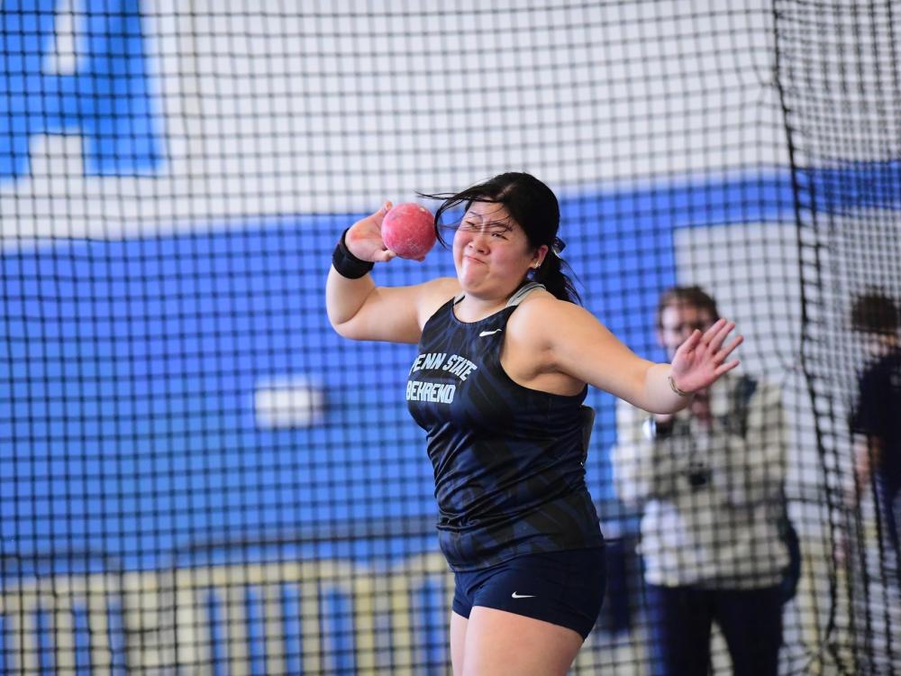 Penn State Behrend track and field athlete Jessica Park throws a weight.