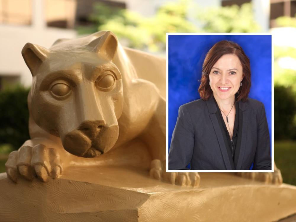 A nittany lion statue rests with its paws over a stone ledge on a college campus, with greenery and buildings blurred in the background. An inset headshot in the corner shows a woman with shoulder-length brown hair wearing a dark blazer and smiling against a blue backdrop.