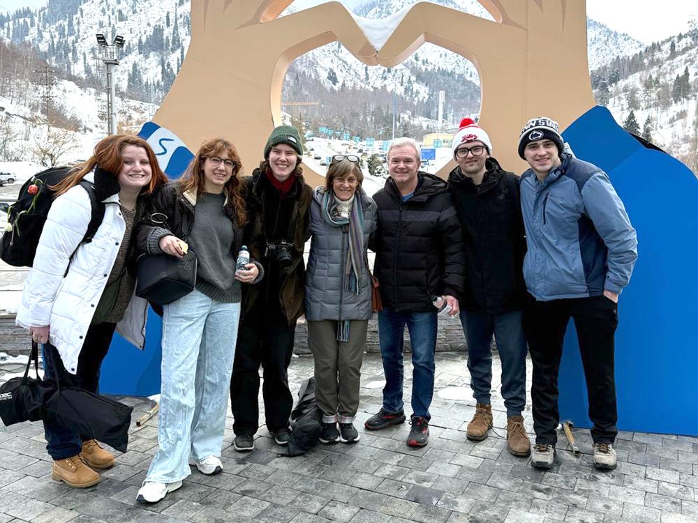 International reporting group, six people standing together