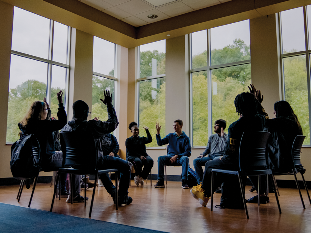 Students sit with their chairs positioned in a circle inside Greater Allegheny's Ostermayer Room.