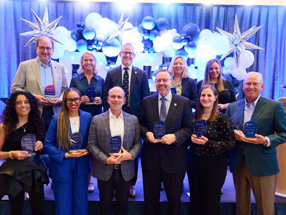 A photo of the five male and five female Smeal Alumni Award winners, along with Dean Corey Phelps