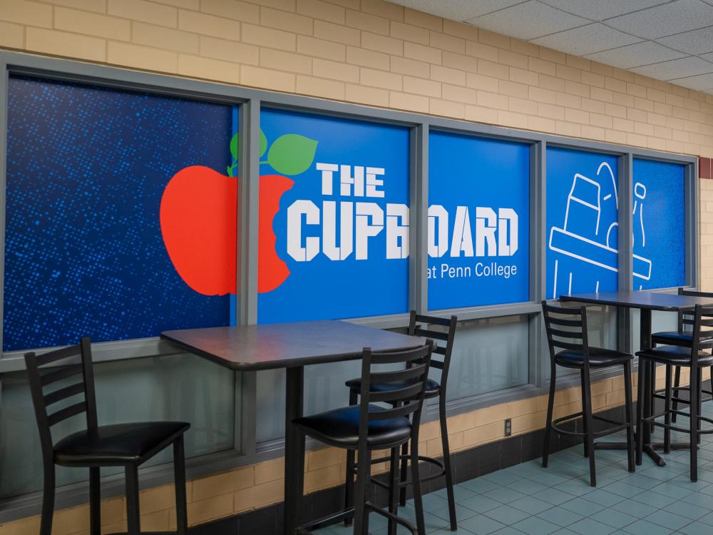 The exterior of the Cupboard, with a bright blue and red window covering