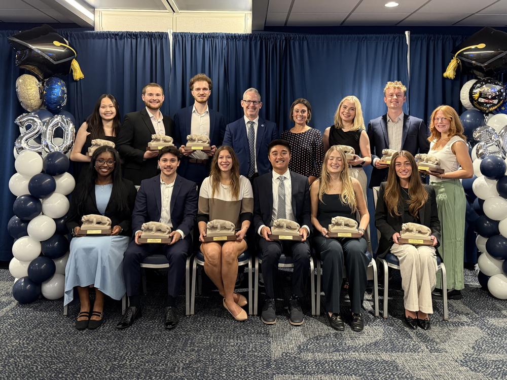 A photo of 12 students who won Smeal Senior Awards holding miniature Nittany Lion Shrines arrayed, sitting and standing, around John and Karen Arnold Dean Corey Phelps and Associate Dean for Undergraduate Education Jennifer EurySmeal’s Senior Award winners were recognized recently in a ceremony at the Bryce Jordan Center. Pictured above are, back row (left to right): Monica Wang, Palmer Moore, Jack McCormack, Dean Corey Phelps, Associate Dean for Undergraduate Education Jennifer Eury