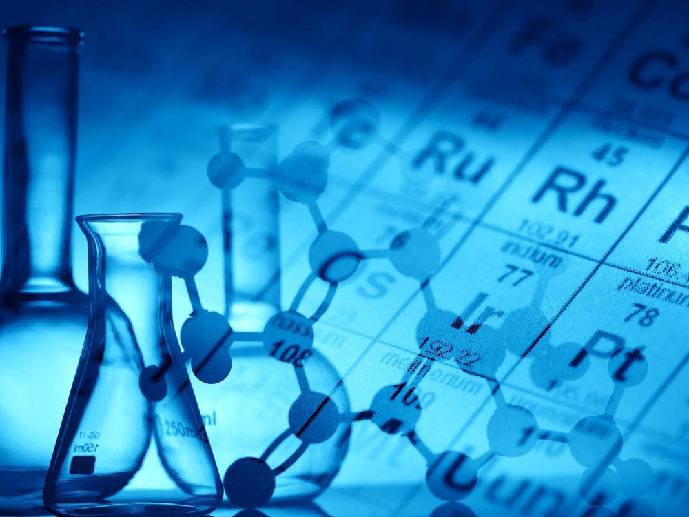 periodic table background with science equipment in front