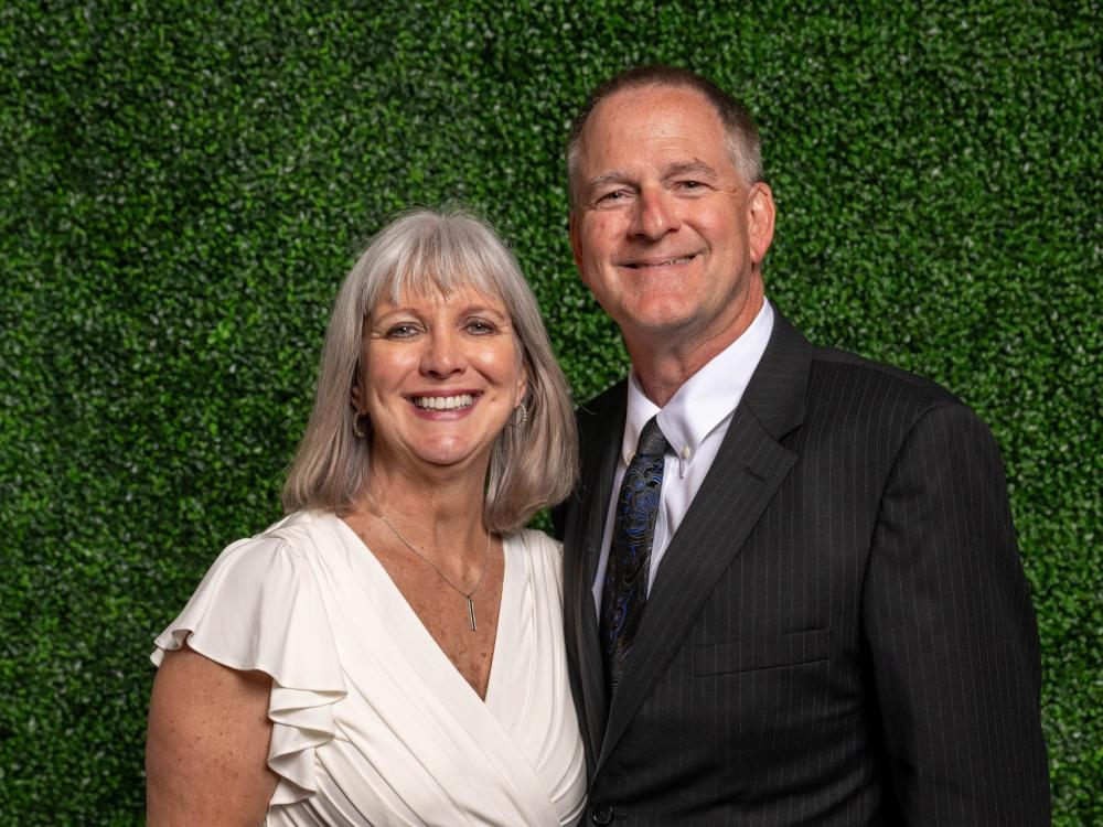 Anne Eisert and Jim Piersol pose for a portrait during an event at Penn State Behrend.