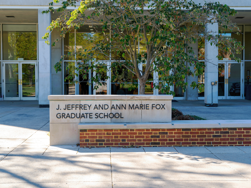Photo of the J. Jeffrey and Ann Marie Fox Graduate School sign in front of Kern Building