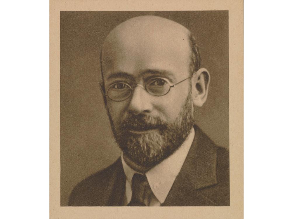 A sepia-toned photograph portrait of Janusz Korczak in 1933