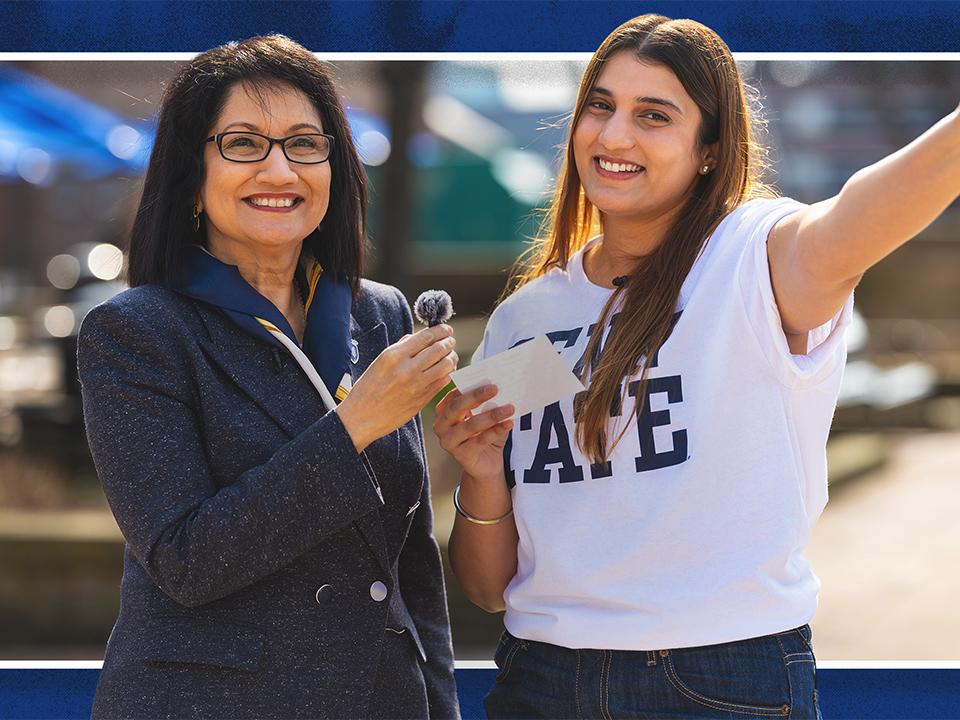 Neeli Bendapudi (left) and student Kavishi Halwavala stand together and Neeli is holding a mic and Kavishi is holding a cell phone.