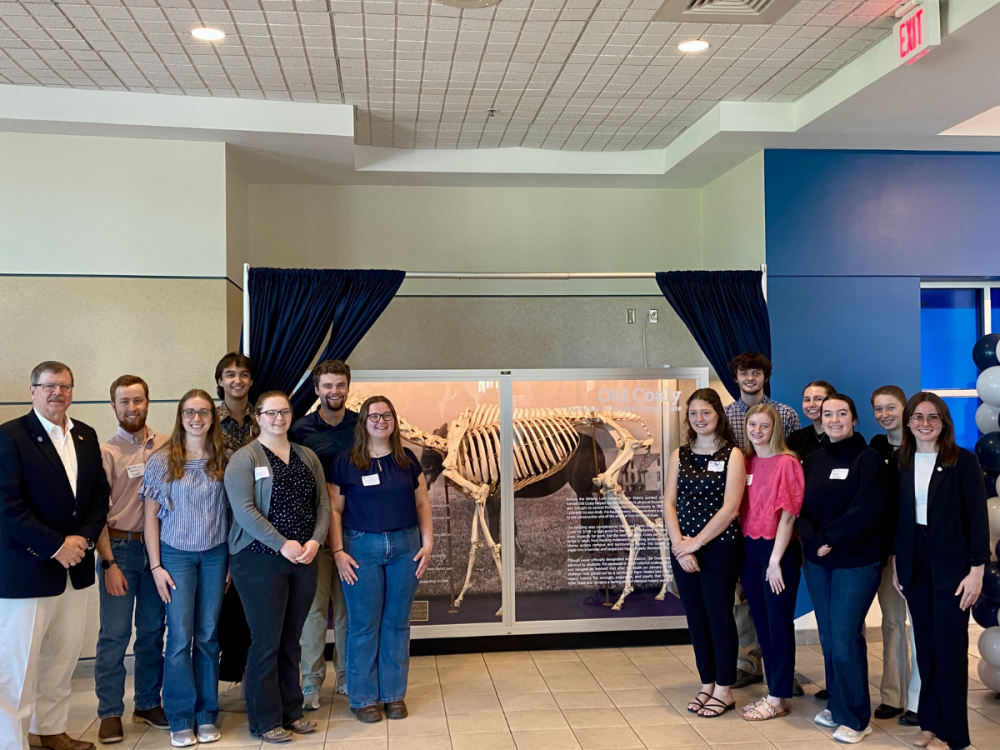 Attendees gathered around the display of Old Coaly's skeleton