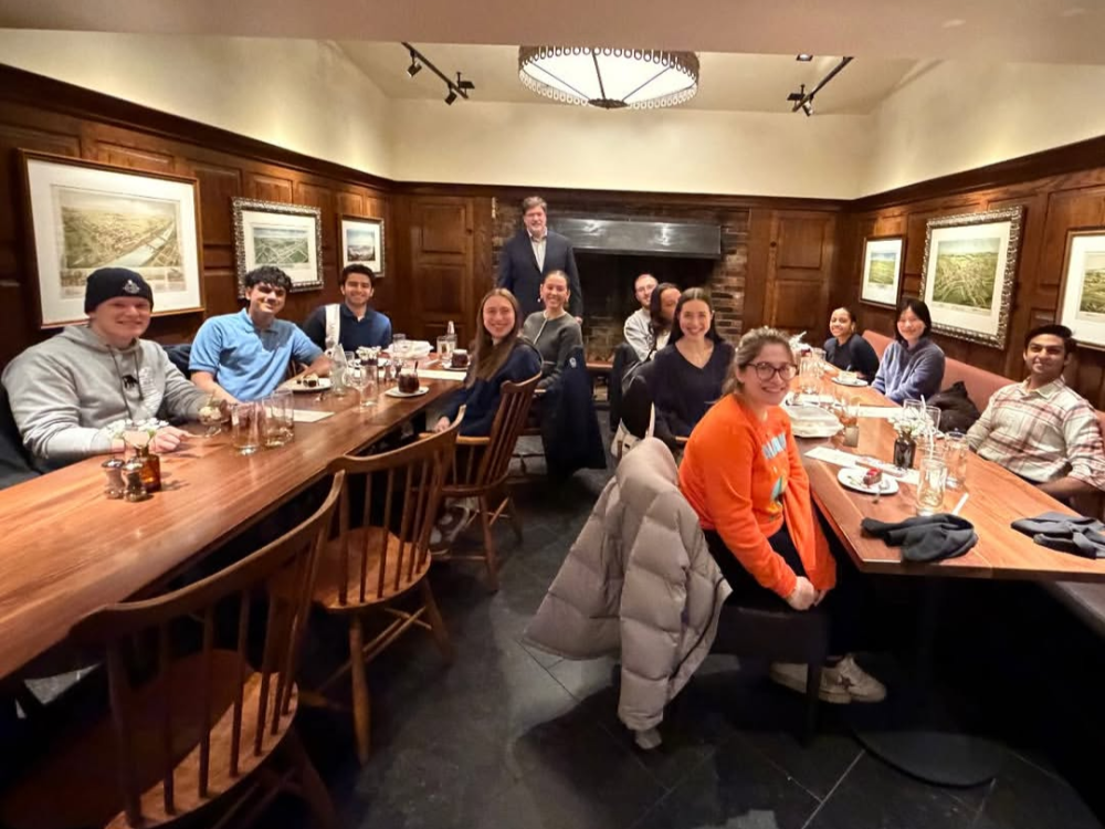 People at tables with food and drink