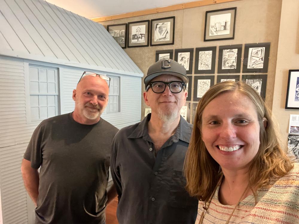 Ben Fehl, Joseph Cusumano and Sarah Zappe posing for a photo in front of various artworks