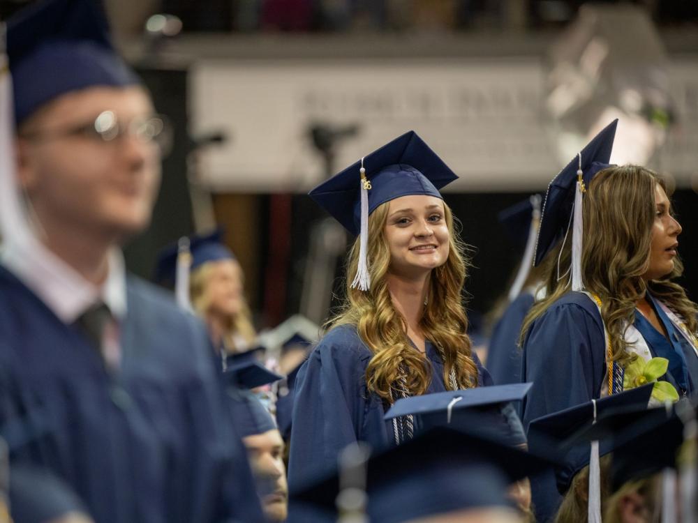 Graduates stand during Penn State Behrend's spring 2026 commencement ceremony.