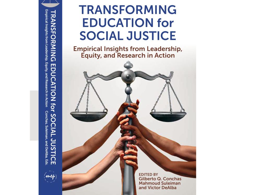 Book cover for Transforming Education for Social Justice: Empirical Insights from Leadership, Equity, and Research in Action, edited by Gilberto Q. Conchas, Mahmoud Suleiman and Victor DeAlba. The cover features multiple hands of varying skin tones holding up a large silver balance scale against a light background, symbolizing equity and collective action. The title appears in large blue and brown text above the image.