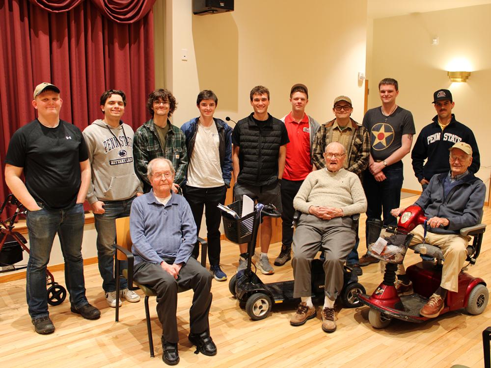 Students meet with three WWII veterans during a trip to Foxdale Retirement Village in State College.