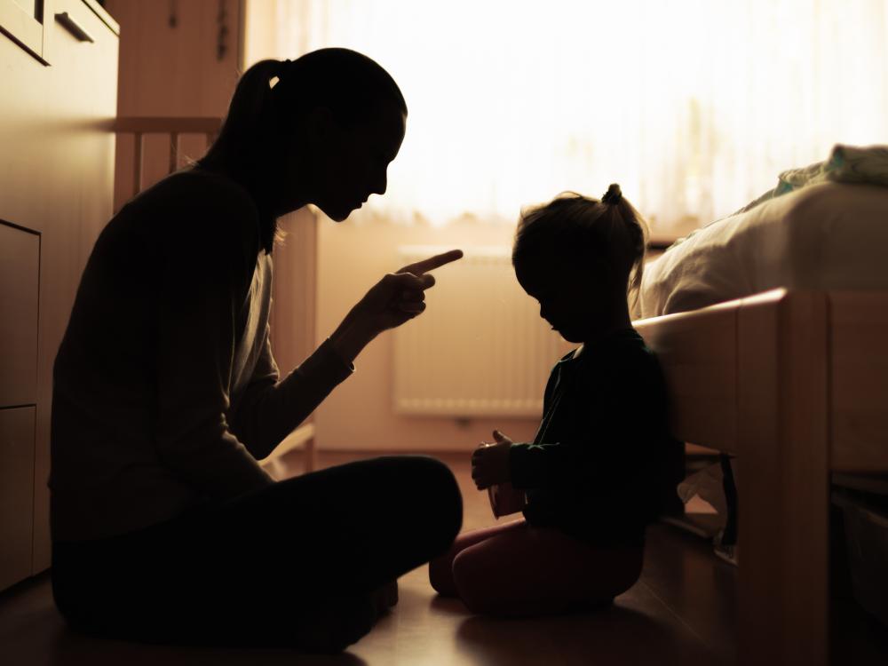 Mother lectures preschooler.