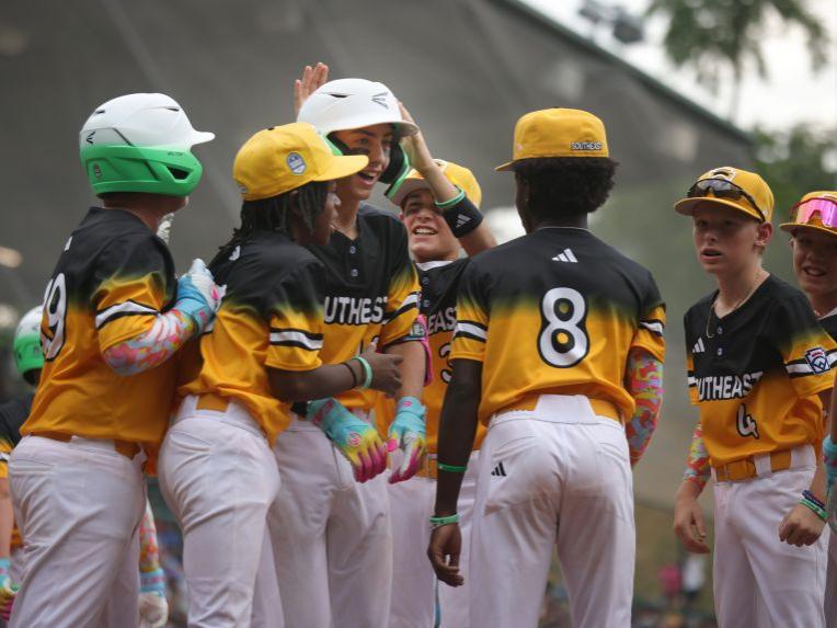 Little League baseball players celebrate