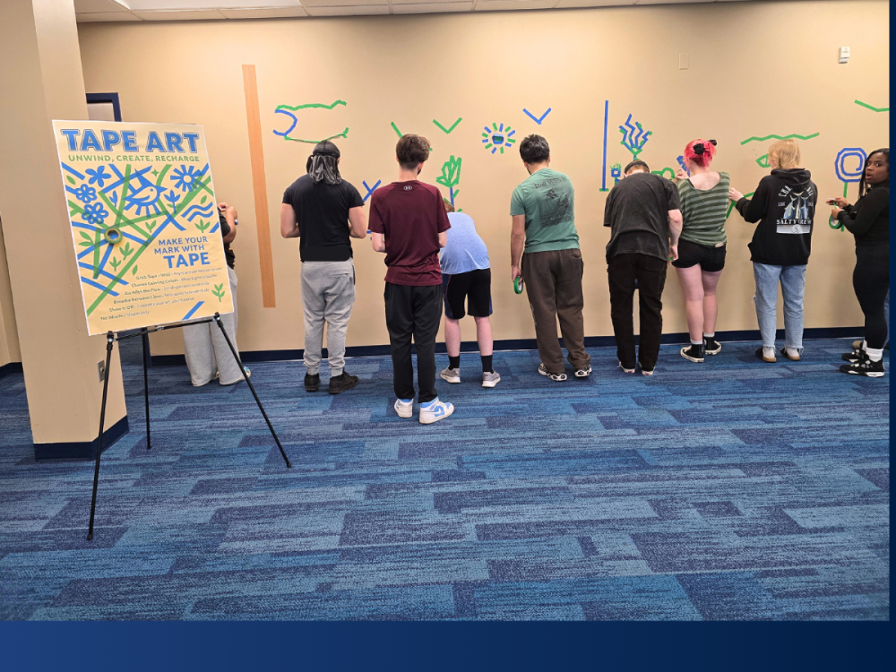 students create a tape wall mural at Penn State Lehigh Valley