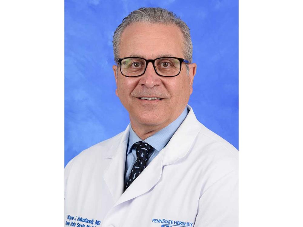 A headshot image of Wayne Sebastianelli in white doctor's coat