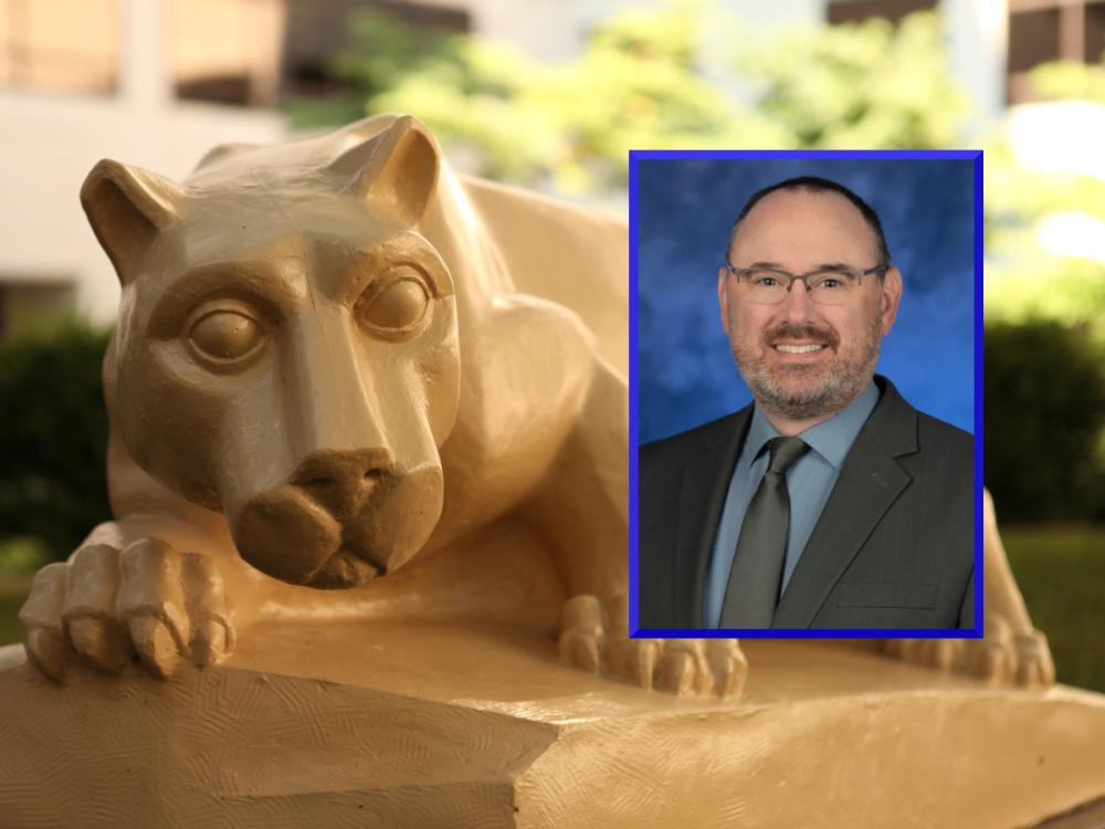 A professional headshot of Bradley Stevens is placed over a photo of a Penn State Nittany Lion statue in an outdoor courtyard.