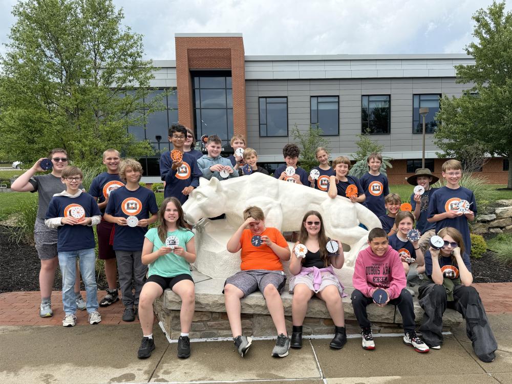 Students from DuBois Area School District who attended the Summer Tech Camp, hosted by Penn State DuBois and the NCPA LaunchBox powered by Penn State DuBois, proudly display their 3D printed clocks at the Lion Shrine on the Penn State DuBois campus. Students designed and printed their clocks during the Summer Tech Camp.