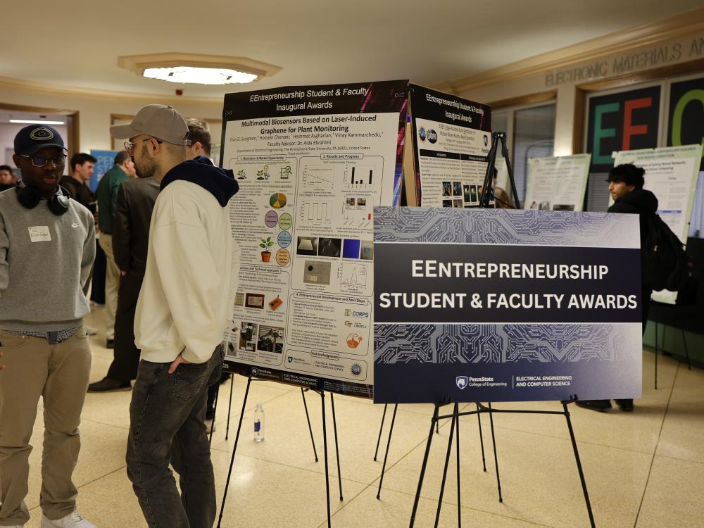 Presenters and attendees at the EEntrepreneur poster showcase during the 2026 Electrical Engineering Student Research Competition