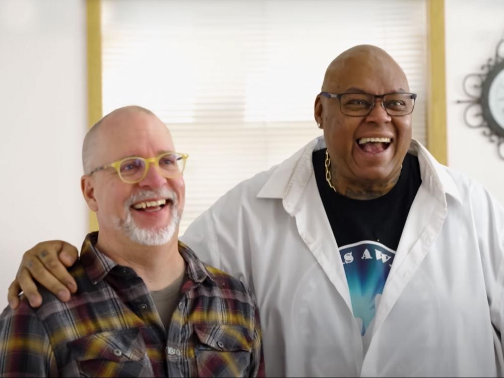 Hobart "Bo" Cleveland and a leader of a recovery community center laughing