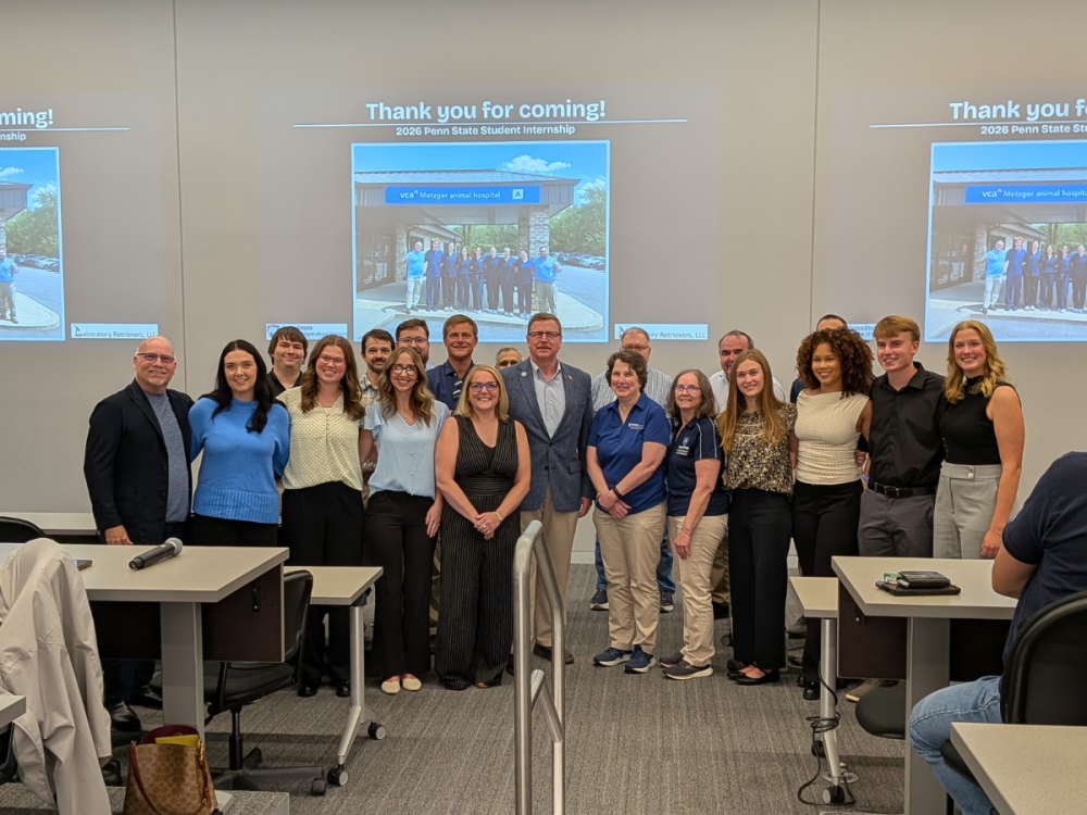 Group shot of the students, dean, and professors
