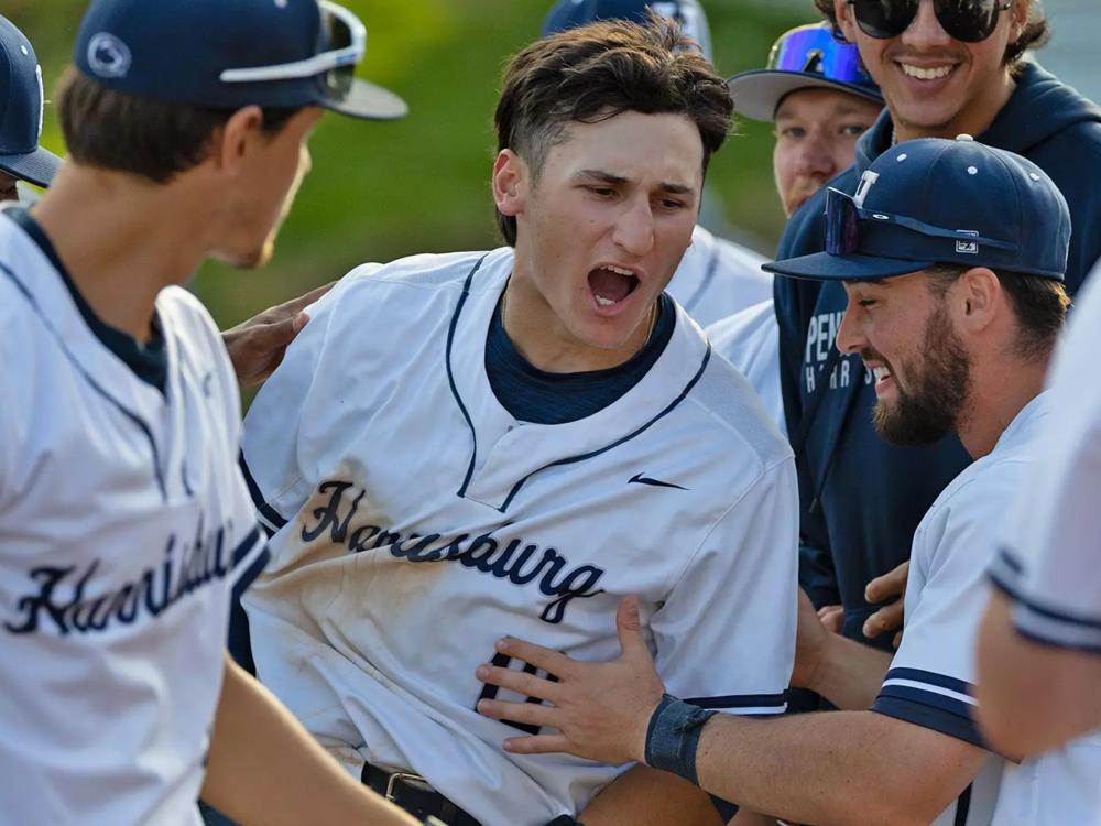 James Quici surrounded by fellow Penn State Harrisburg baseball players