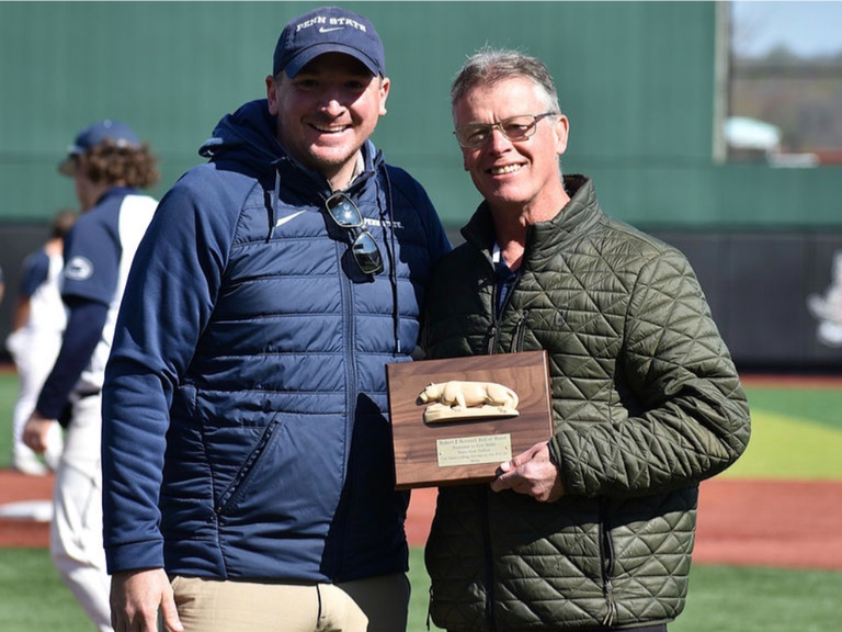 Penn State DuBois athletic director Ken Nellis (right) was awarded the Robert J. Scannell Roll of Honor by PSUAC Commissioner Ryan Ehrie in May for his many contributions to the conference over his 16 years with the University.