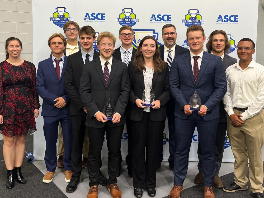 The Penn State Survey Club pose for a photo with their award.