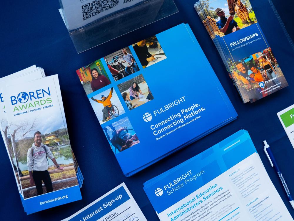 Fulbright program pamphlets and informational booklets sit are displayed on a table