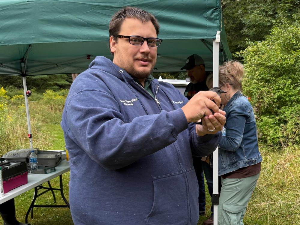 John Dubel, Master Watershed Steward, at a bird banding event.